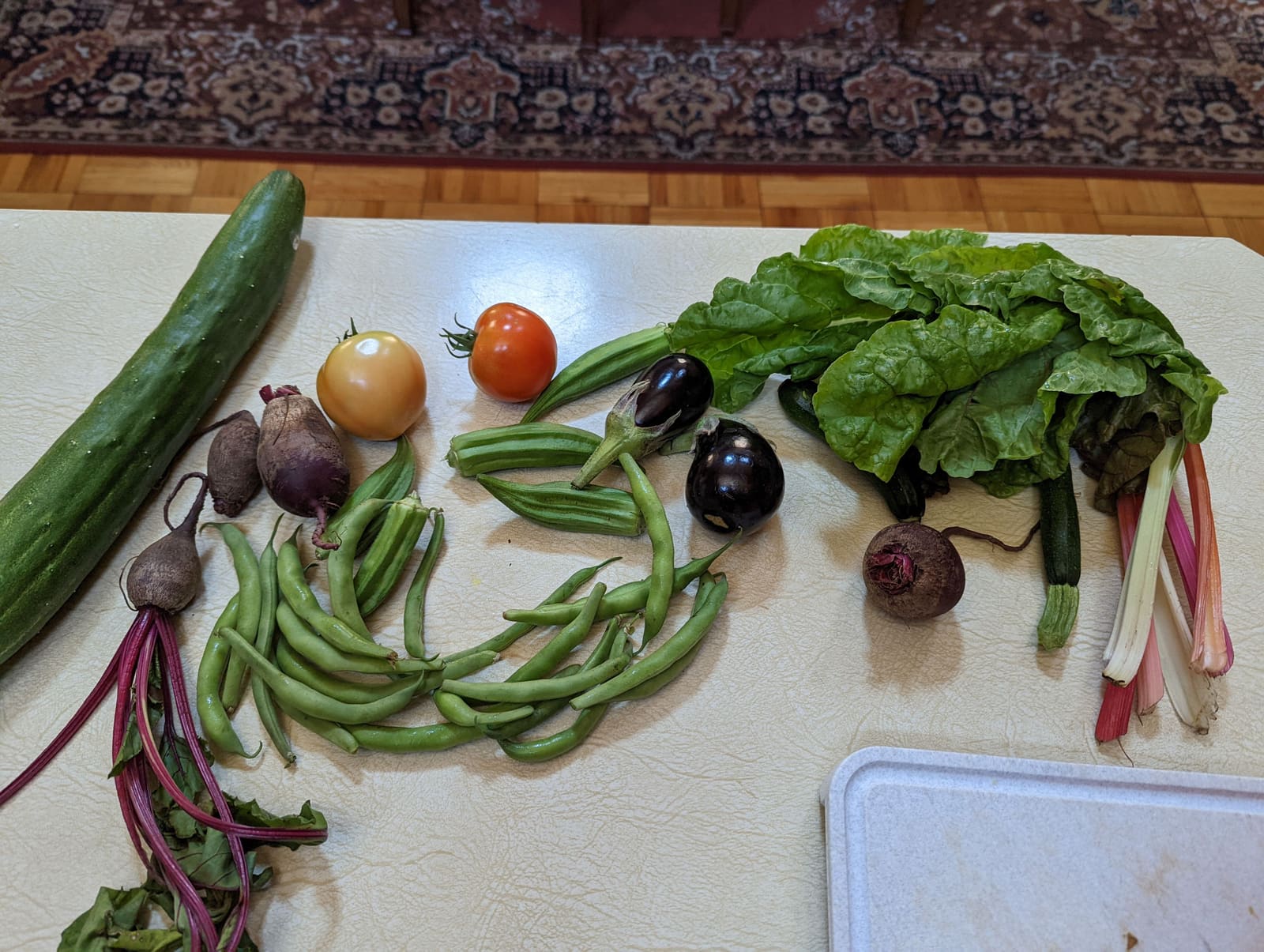The week's harvest arranged on the table. July 2022.