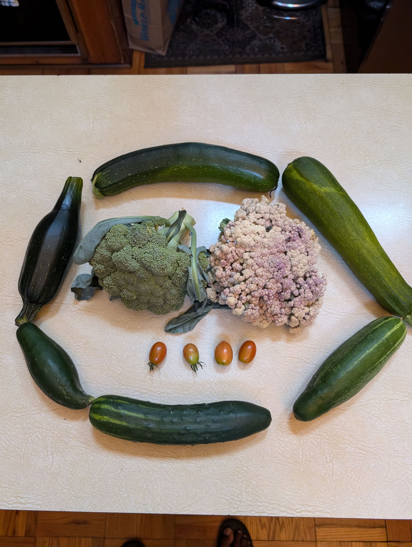 The week's harvest arranged on the table. July 2024.